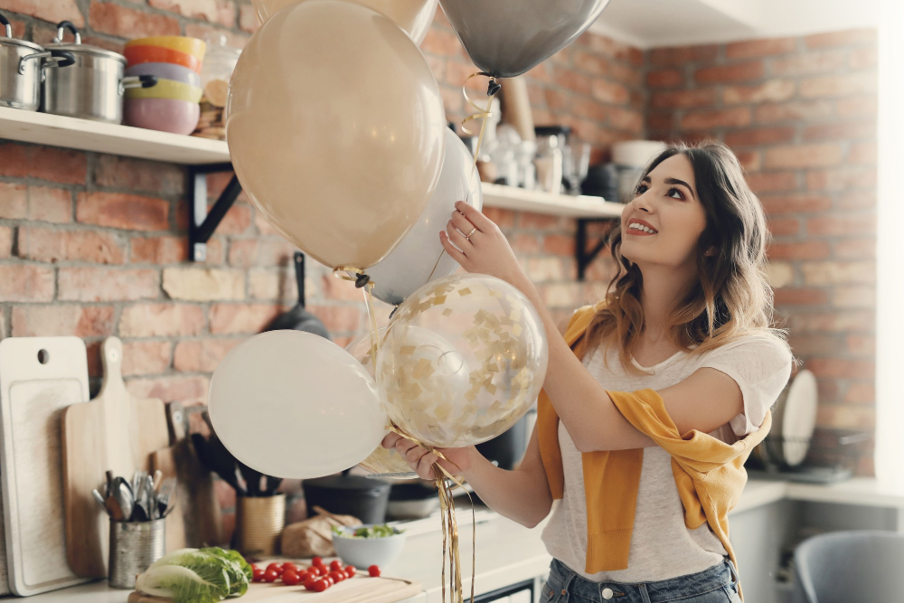 Young woman holding balloon